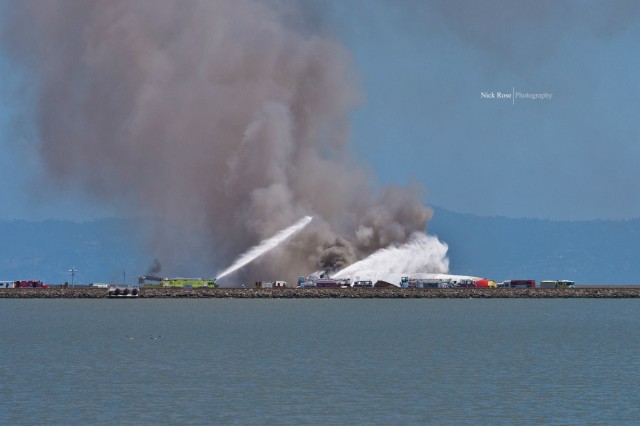 Fire trucks tend to Asiana Airlines Flight 214 at SFO. Photo by Nick Rose. 