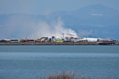 The Asiana Boeing 777 smolders. Photo by Nick Rose.