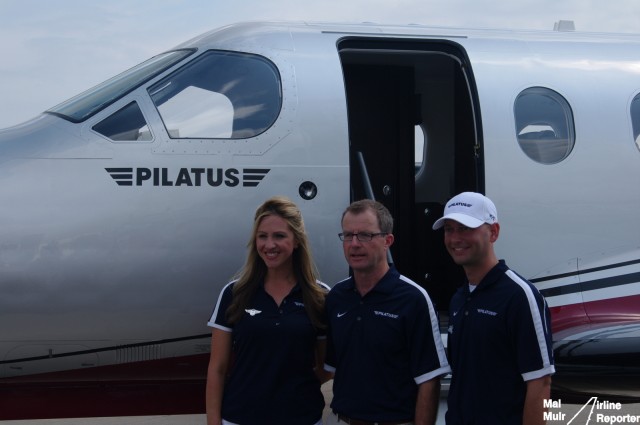 Amelia Rose Earhart (Left), Pilatus Business Aircraft CEO Thomas Bosshard (Middle) & Patrick Carter (Right) pose infront of a PC-12NG at EAA AirVenture - Photo: Mal Muir | AirlineReporter.com