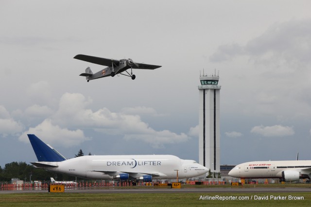 This is the only Hamilton H-47 [first flown in 1928] in the world left flying. It was caught taking off from Paine Field with a Dreamlifter and 787 Dreamliner in the background.