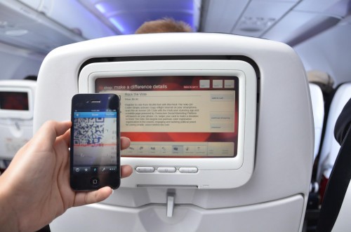 Use your smart phone to scan the QR code on RED and register to vote. Image from Virgin America.