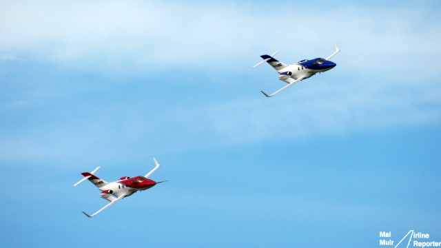 Two FAA Conforming HondaJet's do a formation fly by at EAA AirVenture in OshKosh - Photo: Mal Muir | AirlineReporter.com