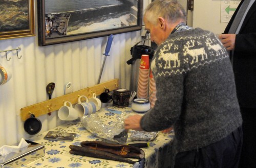 the Kjartan Halldórsson prepares smoked eel for a local patron