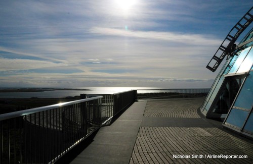 The summer"s ever-persistent sun over the Perlan (the Perl), a hot water storage facility turned museum and mall