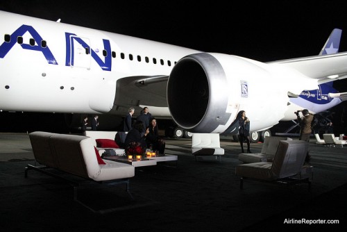 Totally a typical evening hanging out on couches, drinking wine, while under a 787 Dreamliner.