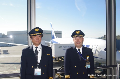 ANA pilots stand in front of the 787 at Sea-Tac.