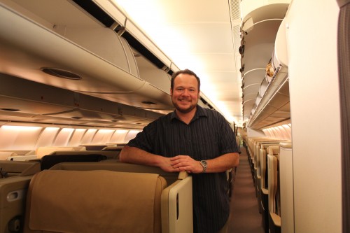 All aboard! Okay, I am cheating a bit here. This is a photo of me on the LAX-SIN A340-500, but you get the idea. Today my shirt is blue.