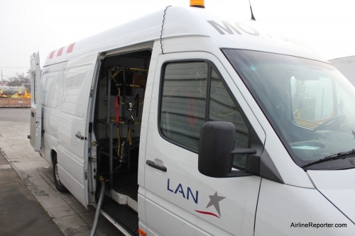 This is an engine cleaning truck (pretty sure that they had a fancier name for it) that can drive to clean the engines of a LAN aircraft.