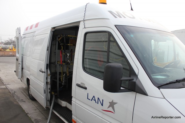 This is an engine cleaning truck (pretty sure that they had a fancier name for it) that can drive to clean the engines of a LAN aircraft. 