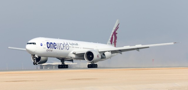 The Oneworld Liveried 777-300ER from Qatar Airways touches down at Hamad International Airport in Doha - Photo: Qatar Airways