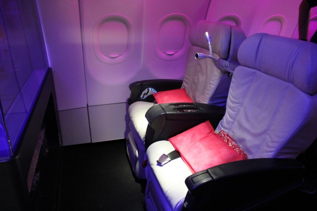Virgin America's first class seats are spacious and colorful. 