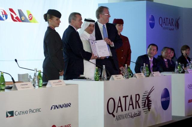 Qatar Airway CEO Akbar Al Baker signs the airline into the Oneworld Alliance in Doha - Photo: Airchive.com