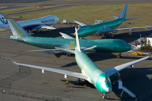 CLICK FOR LARGER: #AvGeek Photo of the Day: Four Boeing 747-8Fs sitting at Paine Field. Can you tell what is missing from each? Image: Bernie Leighton.