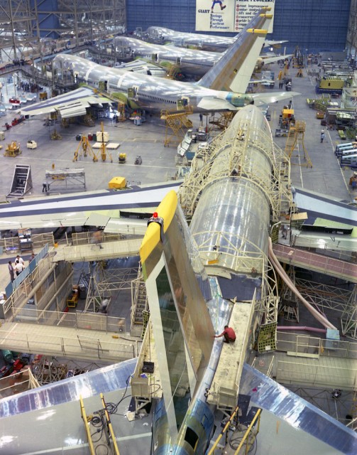 Body join on an early Boeing 747 in the foreground. Note "The Incredibles" logo on the hangar door. Image Courtesy: Boeing