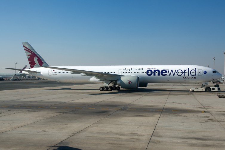 One of Qatar's two Oneworld 777s taken through the window of a QR A320 photo by Bernie Leighton | AirlineReporter.com