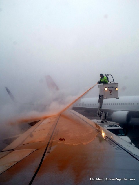 A Common Site during the winter months... getting deiced - Photo: Mal Muir | AirlineReporter.com