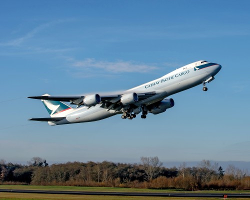 CLICK FOR LARGER PHOTO. From Boeing: EVERETT, Wash., Dec. 18, 2013 /PRNewswire/ -- Boeing (NYSE: BA) today delivered the first 747-8 with performance-improved GEnx-2B engines as part of the airplane's Performance Improvement Package (PIP.) A Cathay Pacific Airways 747-8 Freighter was the first 747 to deliver with the PIP engines. The engine is the first of the package's three improvements to enter service. The two other components, Flight Management Computer (FMC) software upgrades and reactivation of the horizontal tank fuel system on the 747-8 Intercontinental, are expected to enter service later this month and in early 2014, respectively. "This is a significant milestone for the 747 program. These upgrades are part of our commitment to continually improve the 747-8 for our customers," said Eric Lindblad, vice president and general manager of the 747 program. The PIP engine improves the airplane's efficiency by 1.8 percent. "With this improvement, 747-8 customers will use roughly 30 less semi-sized trucks of fuel per airplane per year," said Bruce Dickinson, 747-8 chief project engineer and vice president. All three PIP components can be retrofitted on the 747-8. The tail fuel reactivation is applicable only for the 747-8 Intercontinental and the FMC upgrades can also be made to 747-400s.