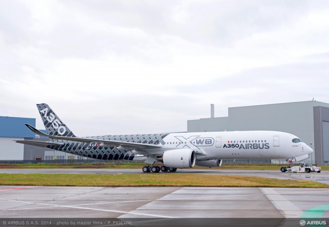 Click Image for Larger Verion. Photo and information from Airbus: On Thursday 2nd January 2014 Airbus rolled-out its third A350 XWB flight-test aircraft, MSN2, from the paint shop in Toulouse, marking yet another successful milestone on the path to entry-into-service in Q4 2014. As well as featuring a distinctive ’œCarbon’ signature livery to reflect its primary construction from advanced materials, this aircraft is also the first of two A350 flight test aircraft to be equipped with a full passenger cabin interior. MSN2 will join the A350 XWB flight test fleet in the coming weeks and will be the first A350 to transport passengers when it undertakes the Early Long Flights (ELF) later in the year. Composite materials in Airbus aircraft have seen a step-by-step introduction that started with the A310 which was first rolled-out in February 1982. Benefiting from over 30 years of composite material experience, 53% of the A350 XWB’s airframe is made-up of carbon-fibre reinforced polymer (CFRP) including Airbus’ first carbon-fibre fuselage.