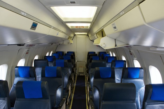 The cabin of an Airlines PNG Dash 8 102. Photo by Bernie Leighton | AirlineReporter.com