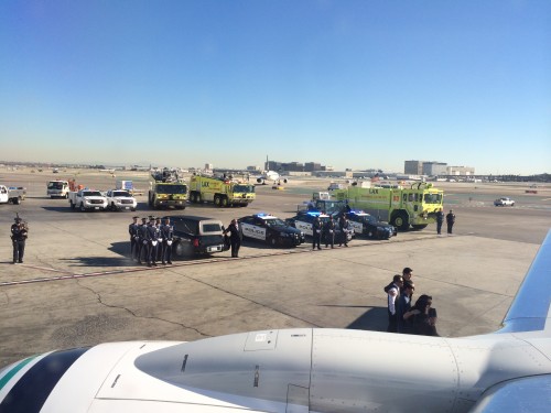 Police and emergency services line up to show respect to the fallen soldier. Photo: David Parker Brown / AirlineReporter.com