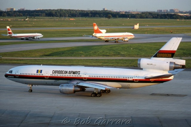 A Caribbean Airways DC-10 with a Lockheed L1011 and Boeing 707 in the background - Photo: Bob Garrard