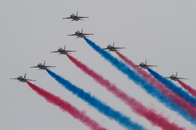 The Korean Air Force Black Eagles Aerobatic display team open the show with a magnificent fly past