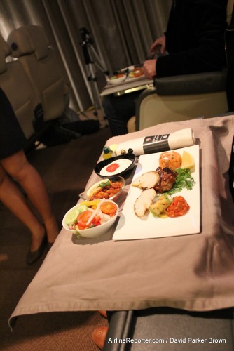 Bon apetit, airline food at ground level, but in an airplane. Wait I am confused.