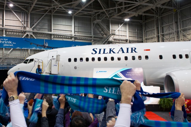 Boeing and SilkAir employees waving ceremonial scarves to celebrate the Lunar New Year: Photo - Bernie Leighton | AirlineReporter.com