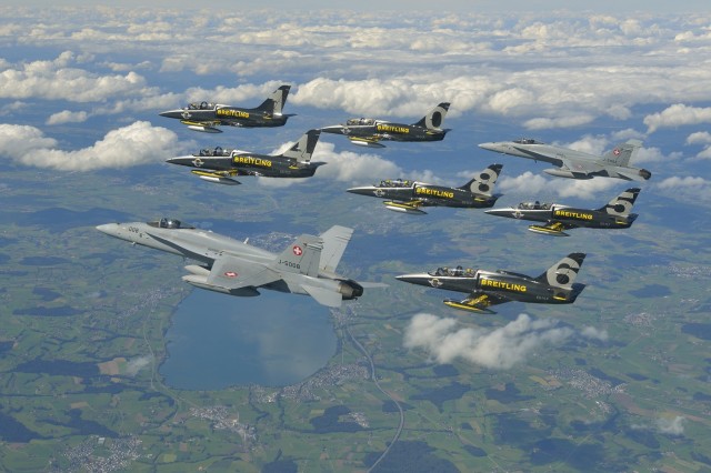 The Breitling Jet Team flying in formation with two Swiss Air Force F/A-18 Hornets - Photo: Breitling SA