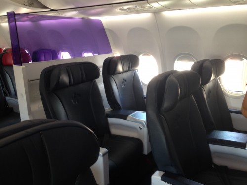 The 8 seat business cabin on-board the 737-800 with the see through divider Photo: Jacob Pfleger | AirlineReporter