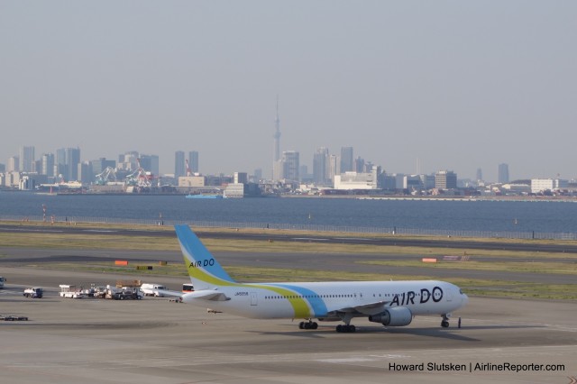 Air Go 767 on the T2 ramp, with Tokyo in the distance.