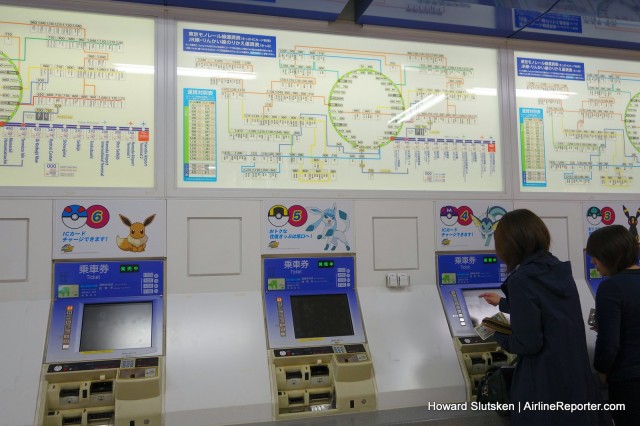 Buying a transit ticket, at the Tokyo Monorail station, Haneda Airport, Terminal 2.