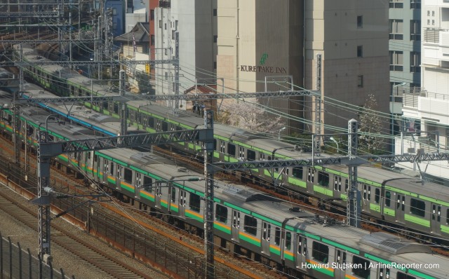 Transit trains in Tokyo - the green stripe is the Yamanote Line.