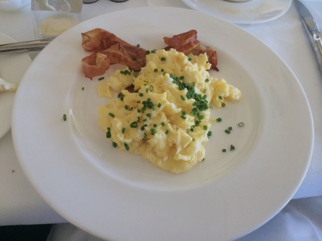 Freshly cooked scrambled eggs and bacon. Photo - Bernie Leighton | AirlineReporter.com 