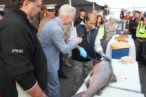 Local celebrity John Curley is emcee for the event while the fish gets filleted