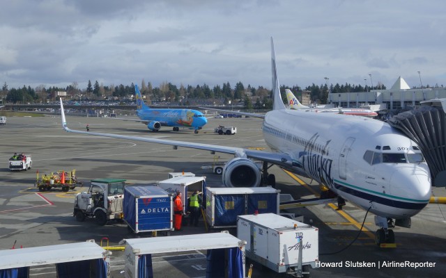 Alaska Air ramp ops at SEA. That's a fuel pump cart below the end of the wing.