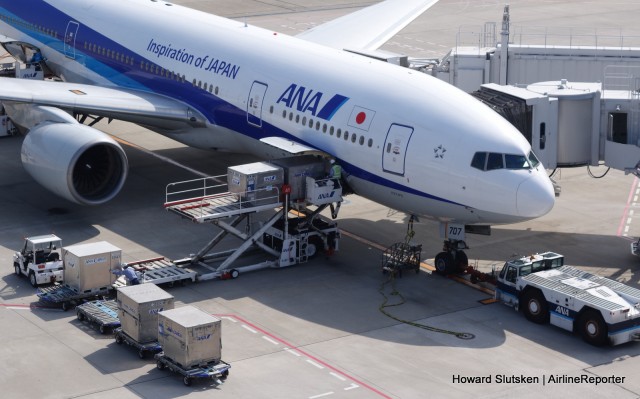 Pods being loaded into an ANA 777-200. Look for the two ground power cables by the nosewheel.