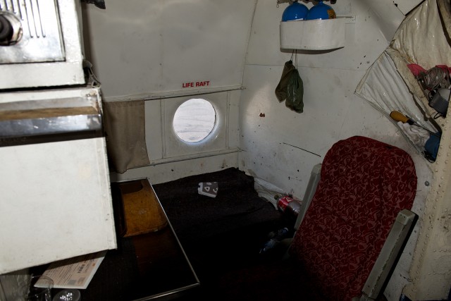 An additional crew-rest seat aboard the AN-12. Photo - Bernie Leighton | AirlineReporter.com  