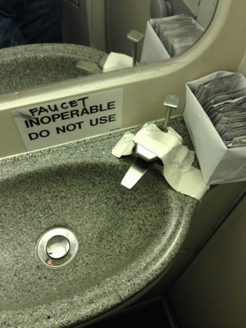 Nothing says "first class" like an inoperable sink in the lav - Photo: Blaine Nickeson | AirlineReporter