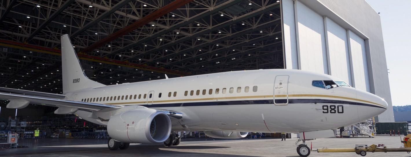 Photo and press release from Boeing: RENTON, Wash., July 16, 2014 /PRNewswire/ -- Boeing (NYSE: BA) rolled out the 5000th Next-Generation 737 this week. The airplane is a Boeing C-40A Clipper, a modified 737-700C, that will serve as a transport aircraft for the U.S. Navy. "This milestone is another testament to the popularity of our Next-Generation 737 and represents the confidence our customers have in the work of our team," said Beverly Wyse, vice president and general manager, 737 program, Boeing Commercial Airplanes. "The 737 is hugely popular with both our commercial and military customers because of its efficiency and proven reliability." Utilizing the 737 commercial platform takes advantage of the proven efficiencies, manufacturing processes and performance of the existing Next-Generation 737 production system. Boeing's P-8 maritime patrol aircraft, Airborne Early Warning and Control (AEW&C) and the C-40 are among the 737 military derivatives. "The quality and dependability of these aircraft are directly linked not simply to their design, but to the hardworking men and women who build them," said Vice Admiral Robin Braun, chief of Navy Reserve and commander, U.S. Navy Reserve Force. To date, orders stand at 6,804 for Next-Generation 737s and 2,109 for 737 MAXs. Total 737 orders have surpassed 12,000 including Classics and more than 100 orders for military derivatives. "With more than 280 different customers, it's easy to see why the 737 is the best selling airplane in the world," said Wyse.