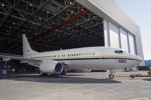 Photo and press release from Boeing: RENTON, Wash., July 16, 2014 /PRNewswire/ -- Boeing (NYSE: BA) rolled out the 5000th Next-Generation 737 this week. The airplane is a Boeing C-40A Clipper, a modified 737-700C, that will serve as a transport aircraft for the U.S. Navy. "This milestone is another testament to the popularity of our Next-Generation 737 and represents the confidence our customers have in the work of our team," said Beverly Wyse, vice president and general manager, 737 program, Boeing Commercial Airplanes. "The 737 is hugely popular with both our commercial and military customers because of its efficiency and proven reliability." Utilizing the 737 commercial platform takes advantage of the proven efficiencies, manufacturing processes and performance of the existing Next-Generation 737 production system. Boeing's P-8 maritime patrol aircraft, Airborne Early Warning and Control (AEW&C) and the C-40 are among the 737 military derivatives. "The quality and dependability of these aircraft are directly linked not simply to their design, but to the hardworking men and women who build them," said Vice Admiral Robin Braun, chief of Navy Reserve and commander, U.S. Navy Reserve Force. To date, orders stand at 6,804 for Next-Generation 737s and 2,109 for 737 MAXs. Total 737 orders have surpassed 12,000 including Classics and more than 100 orders for military derivatives. "With more than 280 different customers, it's easy to see why the 737 is the best selling airplane in the world," said Wyse.