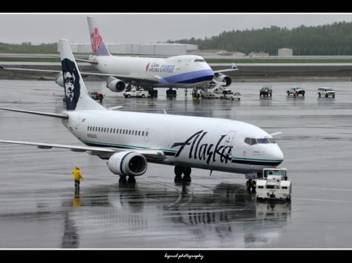 An Alaska Airlines' combi with a China Airlines Cargo 747 in the background