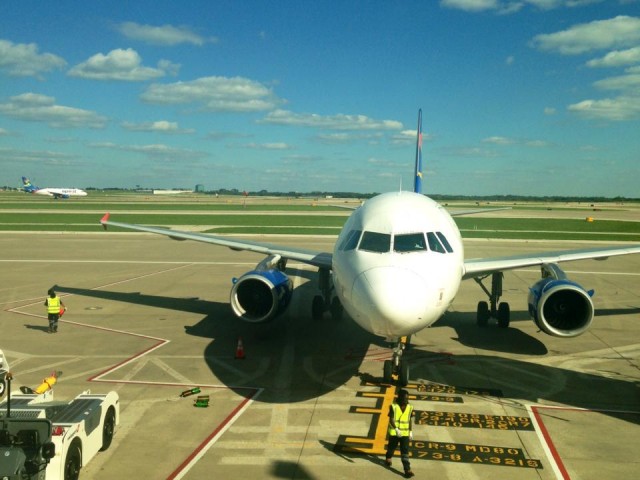 A Spirit A319 pushing back from the gate in KC as another approaches. Photo: KC Aviation Dept.