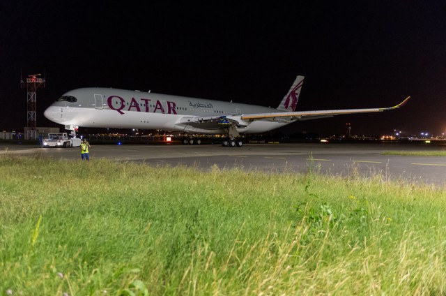 The First Freshly painted A350 XWB for Qatar Airways rolls out of the paint hangar in Toulouse.  Photo: Airbus