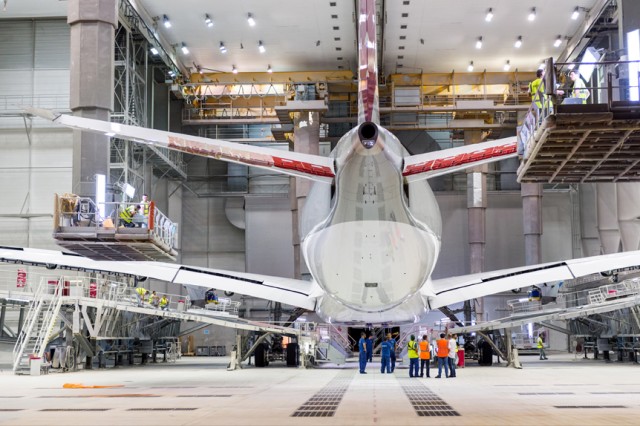 The First A350XWB for Qatar seen still inside the paint hangar shortly before rolling out.  Photo: Airbus