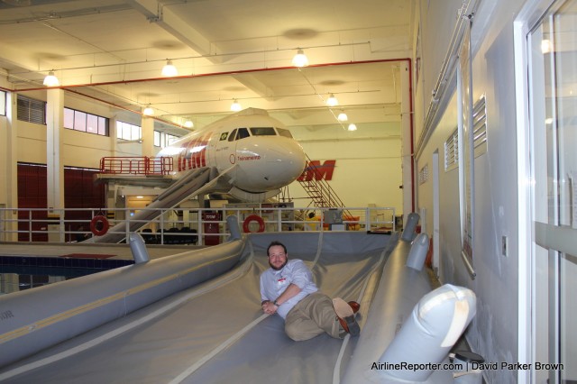 Hanging out on a safety slide next to the TAM pool. Lots of funny jokes about pushing me in