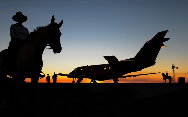 A rendering of the large cargo door being opened at a simulated Australian Cattle Station. Rendering - Pilatus 