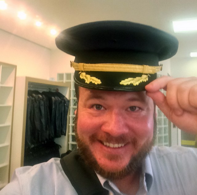 Reporting for duty! Trying on a captain's hat -- looks good. Photo: David Parker Brown