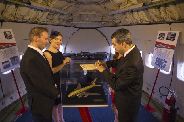 Daniel, my best Man, signs our Marriage Certificate on top of a display of an original 747 design - Photo: Jennifer Nagle