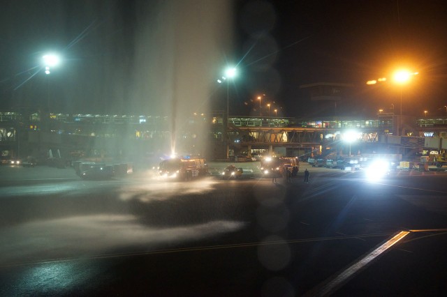 An early morning water cannon salute for the final commercial passenger MD-11 landing. Photo - Bernie Leighton